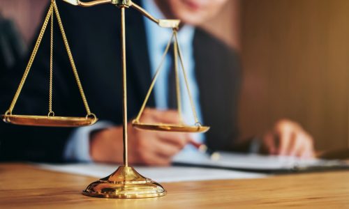 Judge gavel with Justice lawyers, Businessman in suit or lawyer working on a documents. Legal law, advice and justice concept.